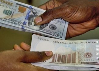 Naira recovers at official window, black market